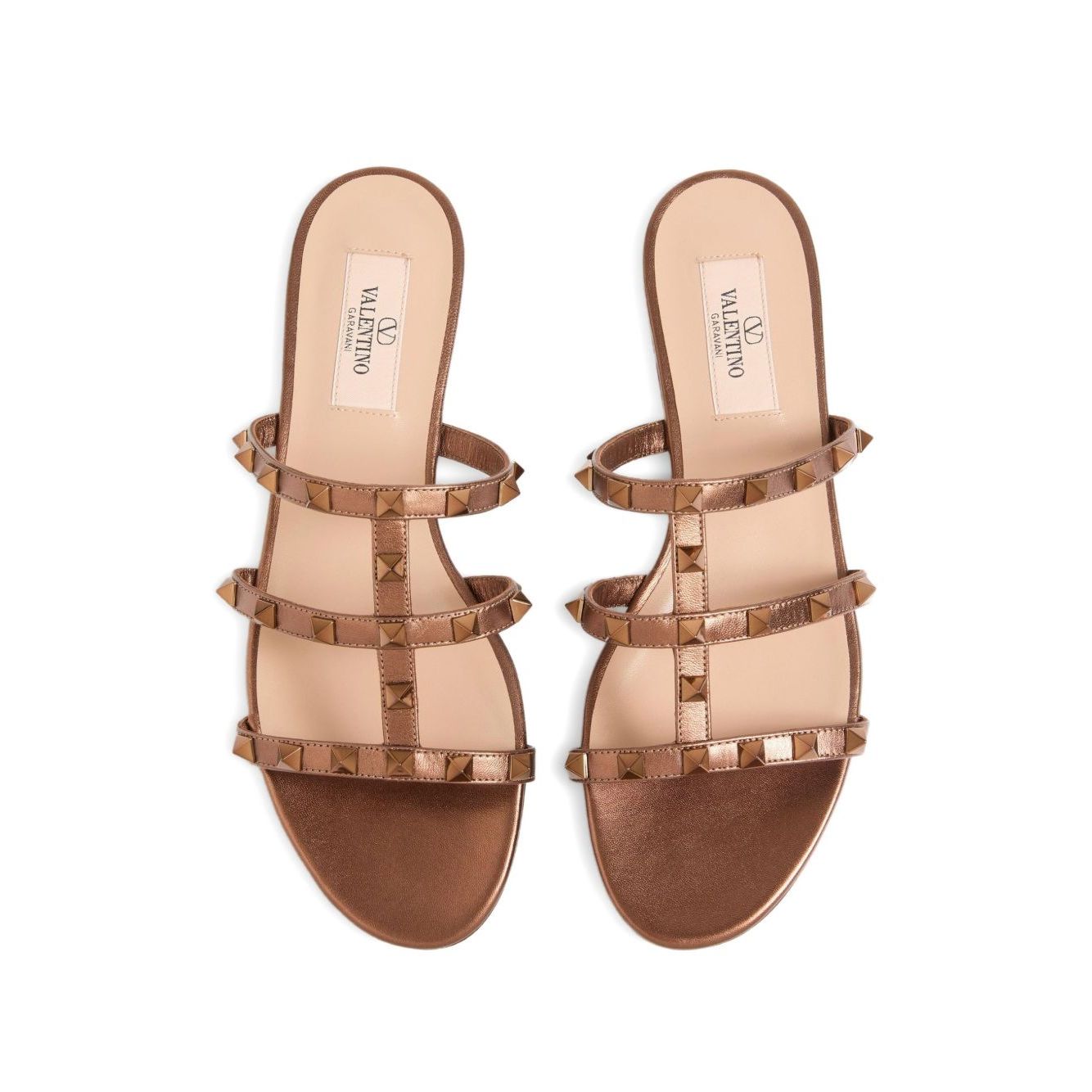 Valentino Garavani Rockstud Low Slide Sandal in Laminated Nappa Leather with brown slip-on design and signature Rockstud accents.