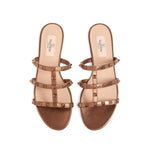Valentino Garavani Rockstud Low Slide Sandal in Laminated Nappa Leather with brown slip-on design and signature Rockstud accents.