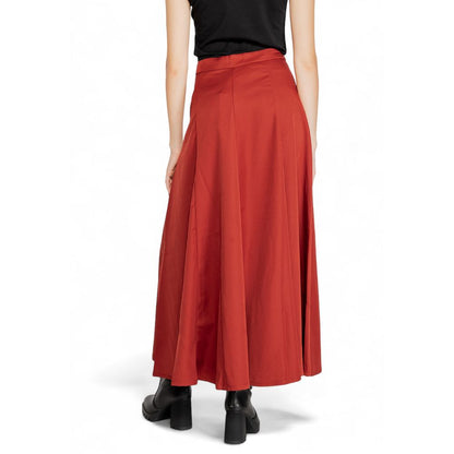 Woman wearing Vero Moda Red Polyester Long Skirt, back view highlighting flared design and high waist.