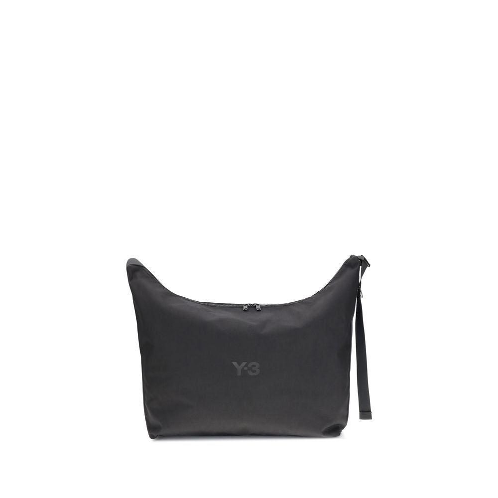 Y-3 Black Polyamide Shoulder Bag with large compartment and adjustable strap, minimal design, logo detail, perfect for everyday use.
