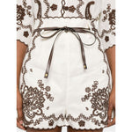 Zimmermann Ascension Shorts in light beige with scallop edge, embroidered design, detachable belt, and concealed rear zip fastening.