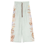Zimmermann Coco trousers in sage green with floral print, elasticated drawstring waistband, silk fabric, true to size fit.