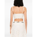 Back view of Zimmermann Cropped top featuring beige tie-fastening straps, floral detailing, and embroidered bodice.