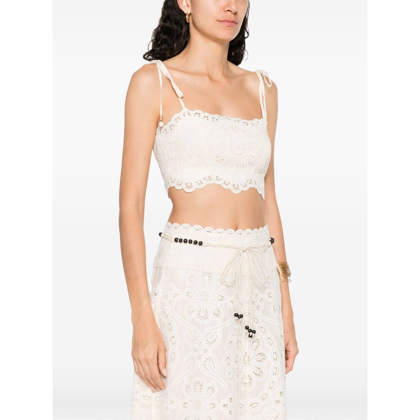 Zimmermann Cropped top with beige tie-fastening straps, floral cut-out, and embroidered bodice.
